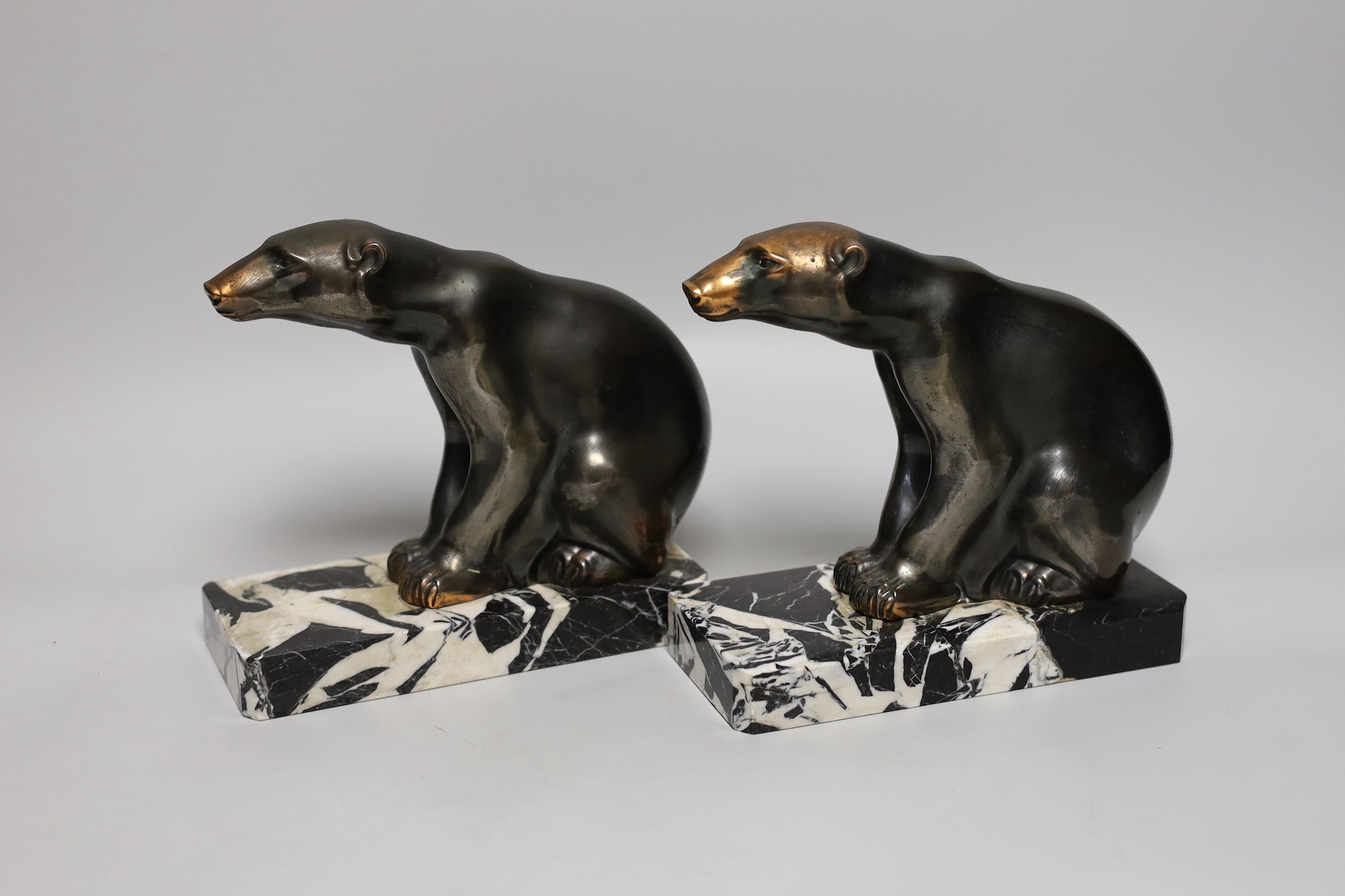 A pair of signed M. Font spelter polar bear bookends, 17cms high